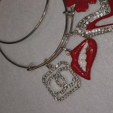 Load and play video in Gallery viewer, SILVER AND RED CHARM BRACELETS
