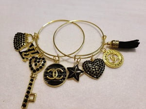 BLACK AND GOLD CHARM BRACELETS