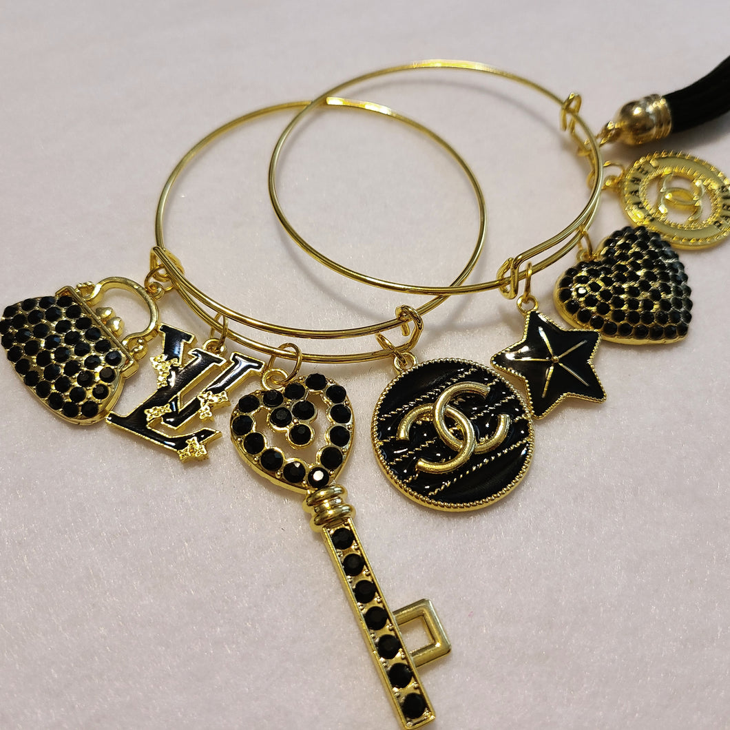 BLACK AND GOLD CHARM BRACELETS