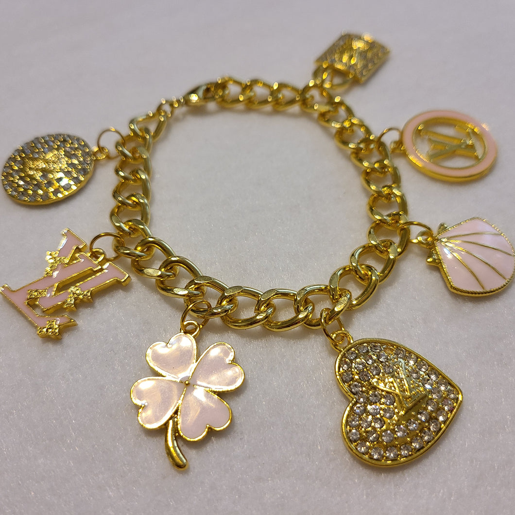 GOLD AND PINK CUBAN LINK CHARM BRACELET